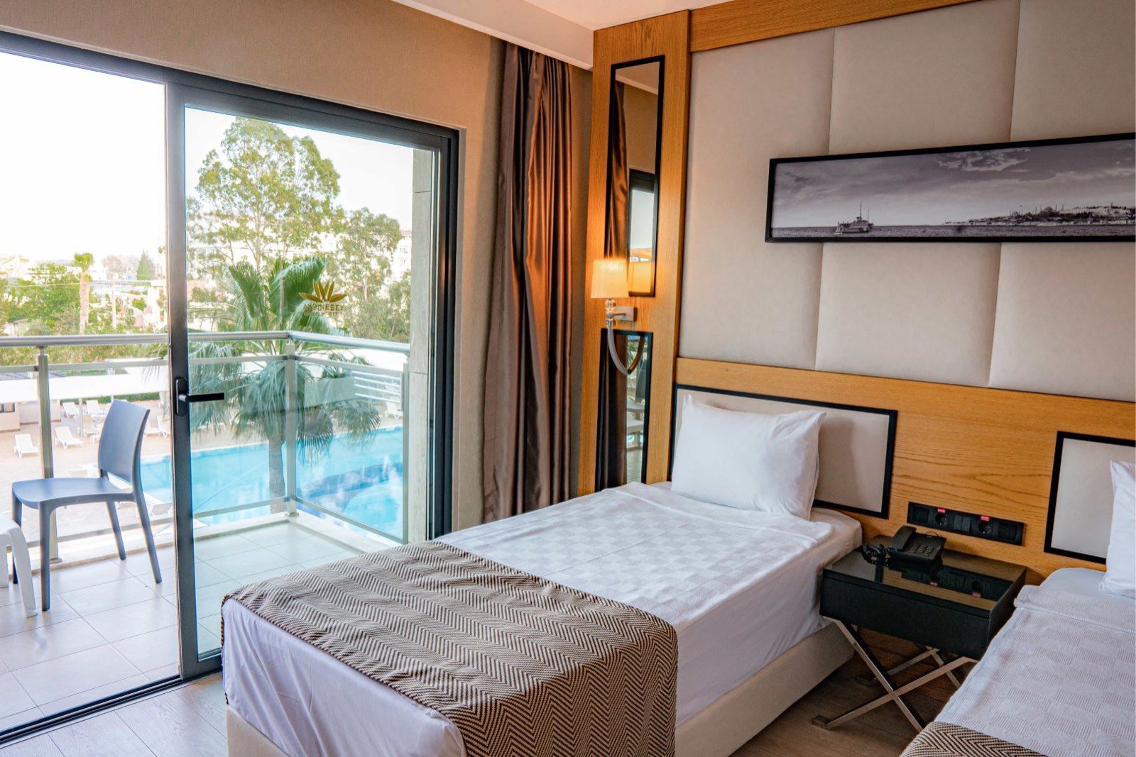 Guest room with pool-view balcony